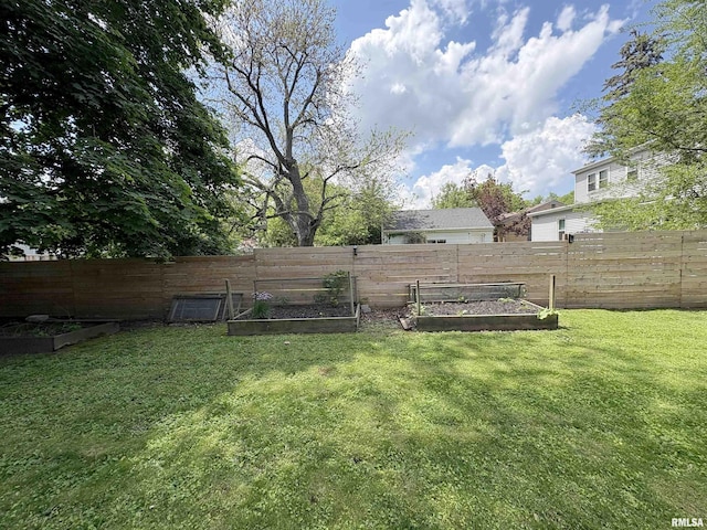 2220 W Ayres Ave, West Peoria, IL 61604 - view of yard with a vegetable garden