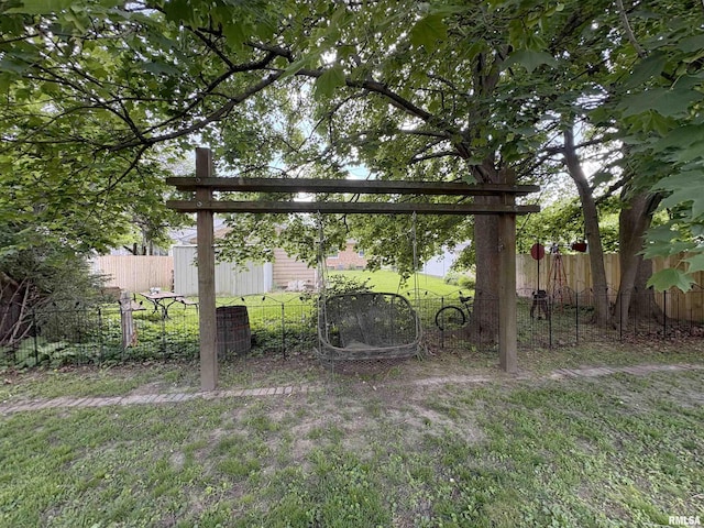 2220 W Ayres Ave, West Peoria, IL 61604 - view of yard featuring fence and an outdoor structure