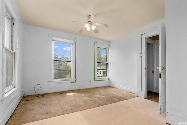 unfurnished bedroom featuring baseboards and ceiling fan