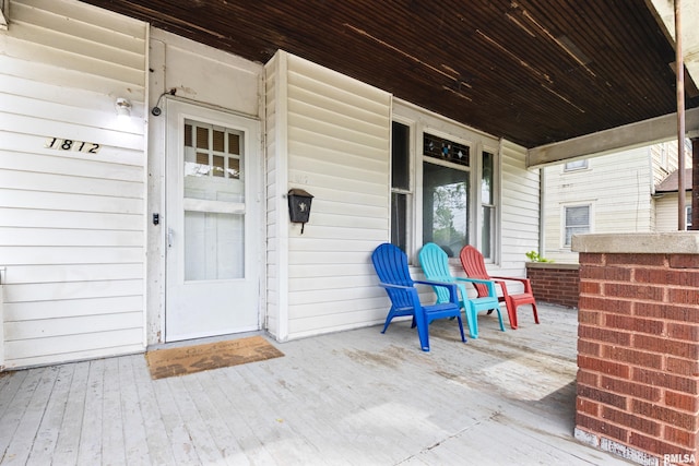 doorway to property featuring covered porch