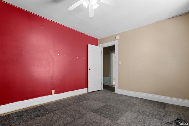 unfurnished room with carpet, a ceiling fan, and baseboards
