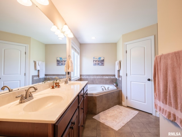 bathroom featuring tile patterned floors, a bath, and double vanity