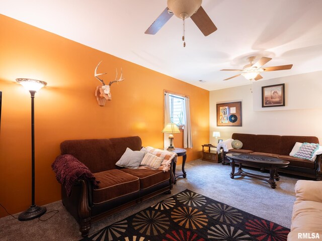 living room with ceiling fan and carpet flooring