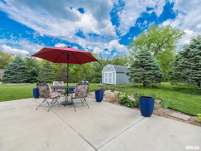 view of patio with a storage unit, an outdoor structure, and outdoor dining space