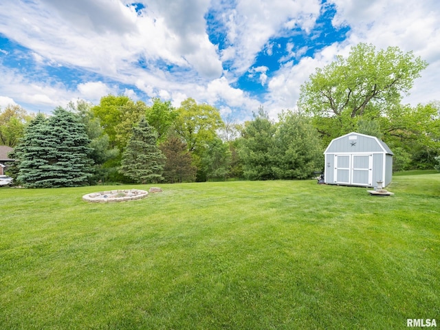 view of green lawn featuring a shed and an outdoor structure