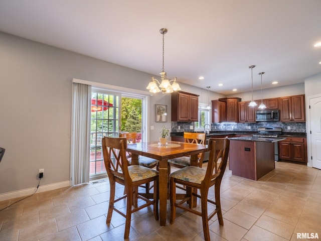 dining space with a chandelier, baseboards, recessed lighting, and light tile patterned floors