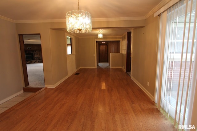 927 W Oakview Dr, Peoria, IL 61615 - unfurnished dining area featuring baseboards, a chandelier, wood finished floors, and ornamental molding