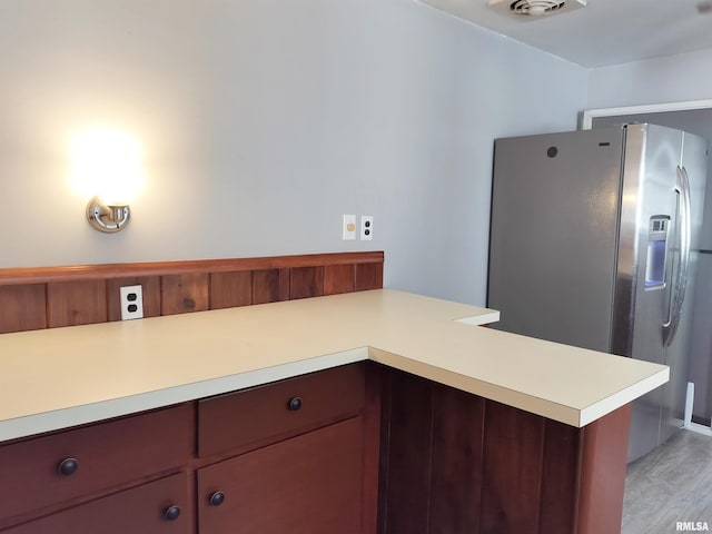 927 W Oakview Dr, Peoria, IL 61615 - kitchen with stainless steel fridge with ice dispenser, light countertops, and light wood finished floors