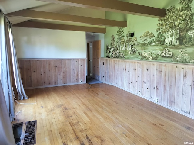 927 W Oakview Dr, Peoria, IL 61615 - unfurnished room with beam ceiling, wainscoting, wood finished floors, and wooden walls