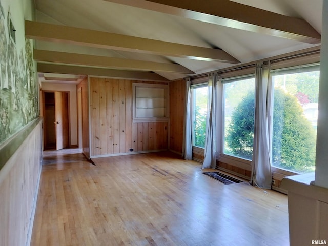927 W Oakview Dr, Peoria, IL 61615 - spare room featuring vaulted ceiling, light wood-style flooring, and wooden walls