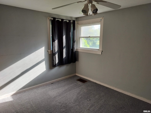 927 W Oakview Dr, Peoria, IL 61615 - carpeted empty room featuring a ceiling fan and baseboards