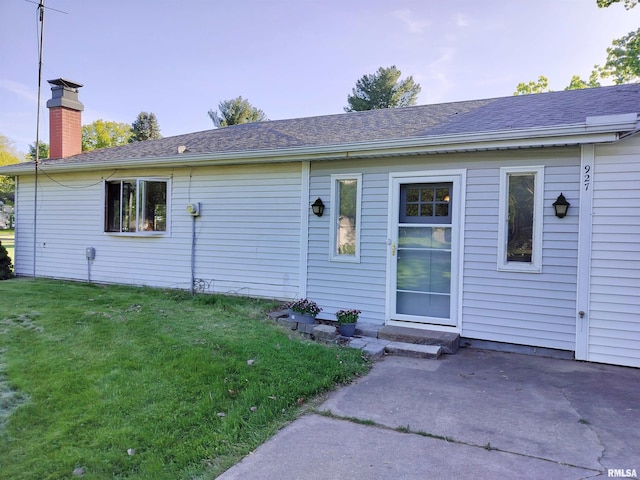 927 W Oakview Dr, Peoria, IL 61615 - rear view of property with a yard, a chimney, a patio, and a shingled roof