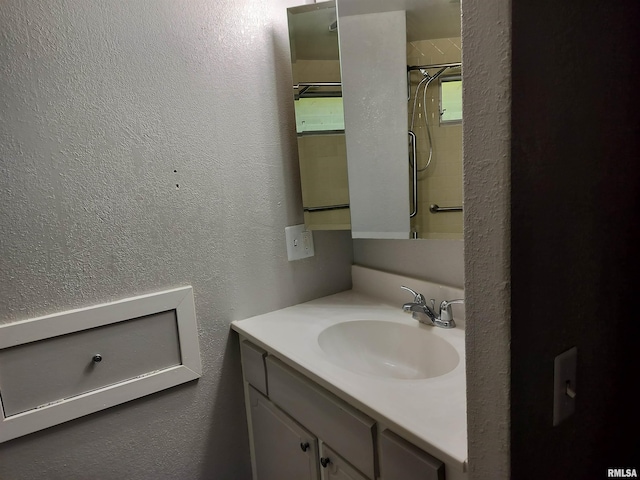 927 W Oakview Dr, Peoria, IL 61615 - full bath with a textured wall, vanity, and a shower