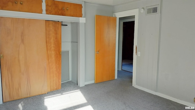 927 W Oakview Dr, Peoria, IL 61615 - unfurnished bedroom featuring a closet, carpet, and baseboards