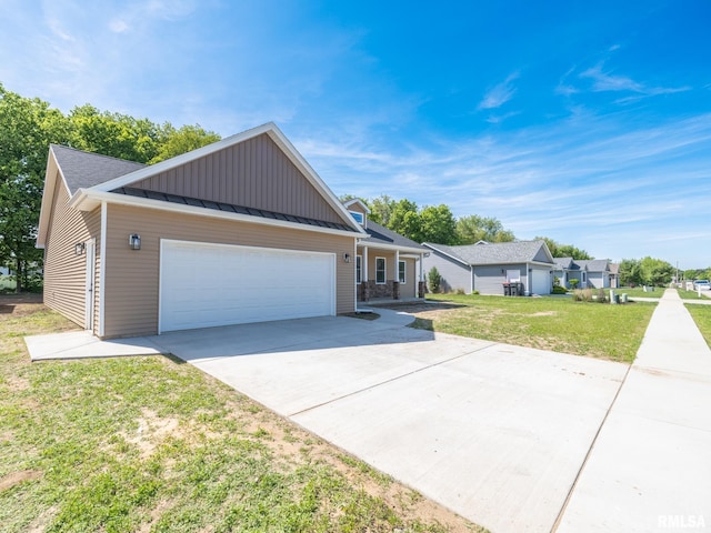 ranch-style house with an attached garage, board and batten siding, a front lawn, driveway, and a standing seam roof