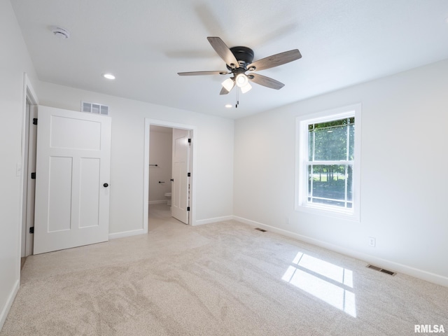 unfurnished bedroom featuring carpet flooring, recessed lighting, baseboards, and ensuite bathroom