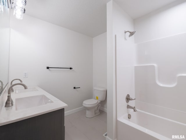 bathroom featuring toilet, shower / tub combination, baseboards, tile patterned floors, and double vanity