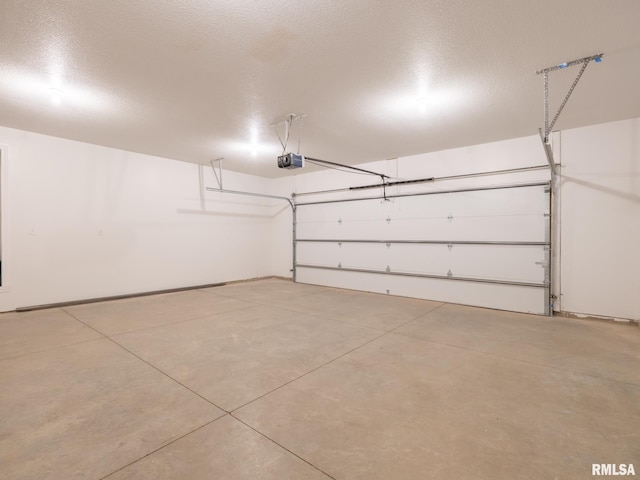 garage featuring a garage door opener and baseboards