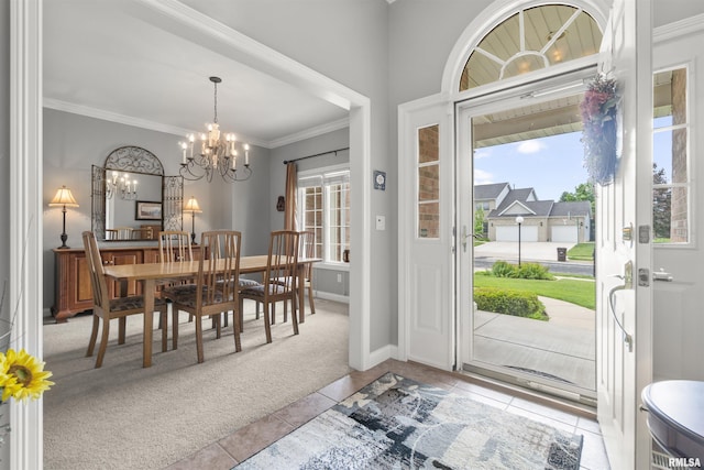 11506 N Bristol Dr, Dunlap, IL 61525 - tiled entrance foyer featuring a chandelier, carpet, crown molding, and baseboards