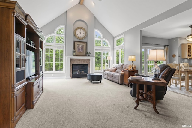 11506 N Bristol Dr, Dunlap, IL 61525 - living room featuring carpet flooring, a glass covered fireplace, a ceiling fan, high vaulted ceiling, and beam ceiling