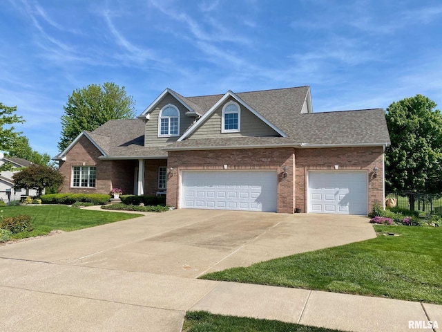 11506 N Bristol Dr, Dunlap, IL 61525 - view of front of house with concrete driveway, brick siding, roof with shingles, and an attached garage