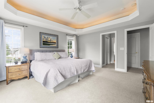 11506 N Bristol Dr, Dunlap, IL 61525 - bedroom featuring a raised ceiling, light carpet, crown molding, baseboards, and a ceiling fan