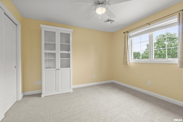 11506 N Bristol Dr, Dunlap, IL 61525 - unfurnished bedroom featuring light carpet, baseboards, and ceiling fan