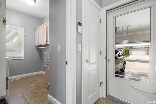 11506 N Bristol Dr, Dunlap, IL 61525 - doorway with plenty of natural light, baseboards, and tile patterned flooring