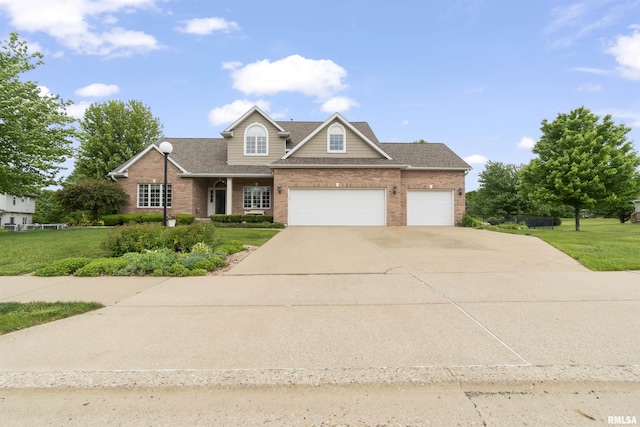 11506 N Bristol Dr, Dunlap, IL 61525 - traditional-style house featuring driveway, brick siding, and a front yard
