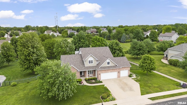 11506 N Bristol Dr, Dunlap, IL 61525 - aerial view of residential area with a tree filled landscape