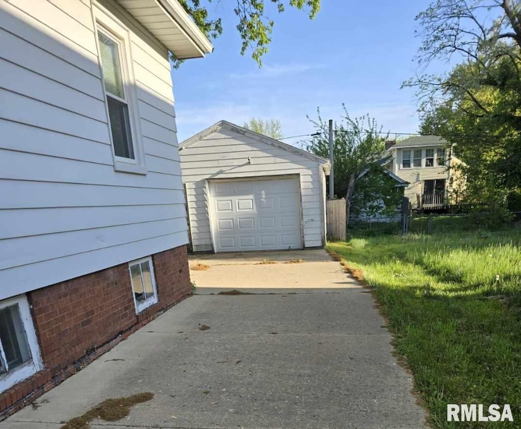 718 W Corrington Ave, Peoria, IL 61604 - view of home's exterior with driveway, an outbuilding, and a detached garage