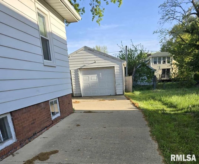 718 W Corrington Ave, Peoria, IL 61604 - view of home's exterior with driveway, an outbuilding, and a detached garage