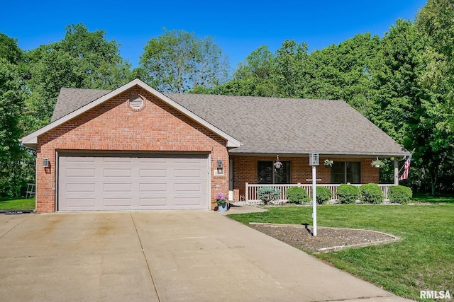 15207 N 7th St, Chillicothe, IL 61523 - ranch-style house featuring a porch, brick siding, driveway, and a front yard