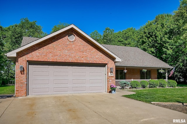 15207 N 7th St, Chillicothe, IL 61523 - ranch-style house with covered porch, brick siding, concrete driveway, and a front yard