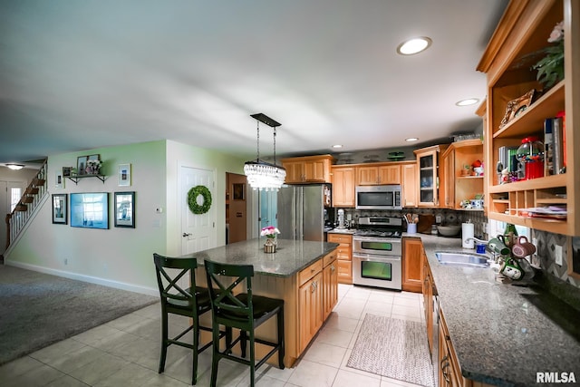 15207 N 7th St, Chillicothe, IL 61523 - kitchen with appliances with stainless steel finishes, a sink, light tile patterned floors, decorative backsplash, and open shelves
