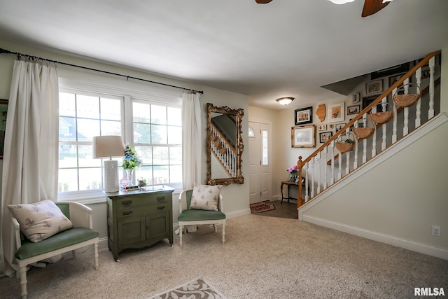15207 N 7th St, Chillicothe, IL 61523 - sitting room featuring stairs, healthy amount of natural light, baseboards, and a ceiling fan