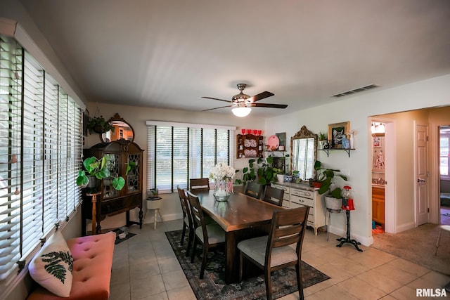 15207 N 7th St, Chillicothe, IL 61523 - dining area featuring light tile patterned floors, a ceiling fan, and baseboards