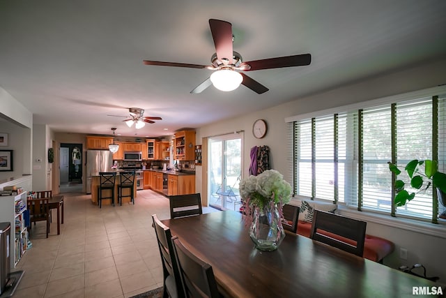 15207 N 7th St, Chillicothe, IL 61523 - dining area with ceiling fan and light tile patterned floors