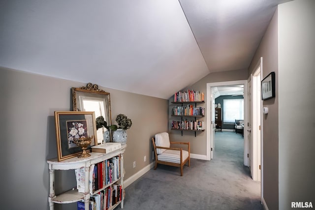 15207 N 7th St, Chillicothe, IL 61523 - living area featuring carpet floors, vaulted ceiling, and baseboards