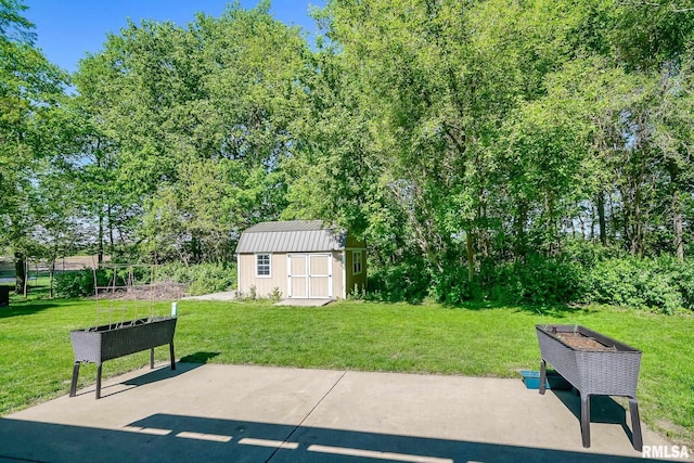 15207 N 7th St, Chillicothe, IL 61523 - view of patio / terrace featuring a storage unit, an outbuilding, and view of scattered trees