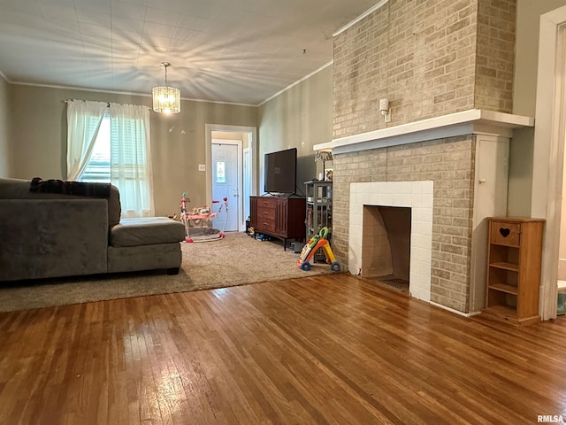 411 W Jefferson St, Macomb, IL 61455 - living room with hardwood / wood-style flooring, ornamental molding, and a fireplace