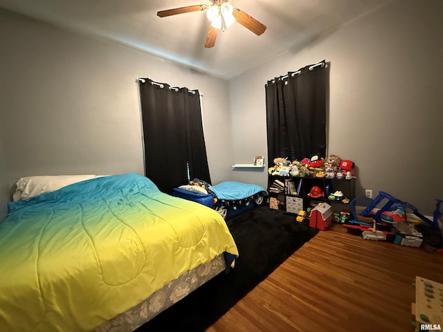 411 W Jefferson St, Macomb, IL 61455 - bedroom featuring wood finished floors, lofted ceiling, and a ceiling fan