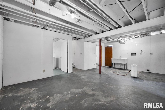 unfinished basement featuring a sink