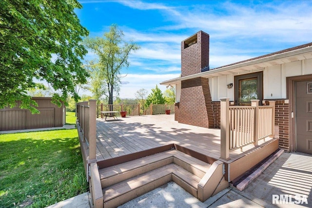 wooden deck with a yard