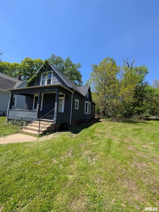 2217 NE Madison Ave, Peoria, IL 61603 - bungalow with a front yard and a porch