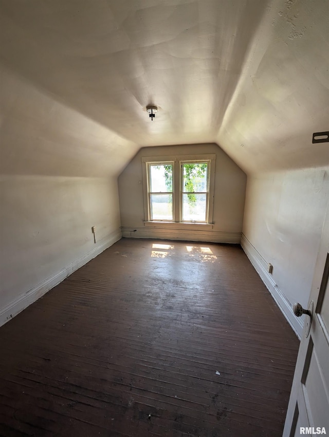 2217 NE Madison Ave, Peoria, IL 61603 - bonus room featuring lofted ceiling, wood-type flooring, and baseboards