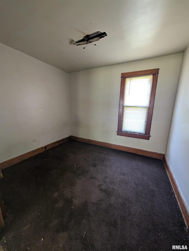 2217 NE Madison Ave, Peoria, IL 61603 - unfurnished room featuring baseboards and carpet