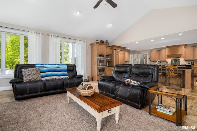 living room with vaulted ceiling, a ceiling fan, and recessed lighting