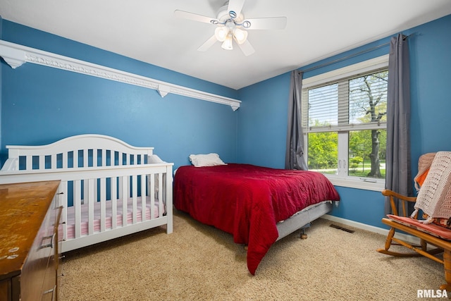 bedroom with baseboards, carpet floors, and ceiling fan