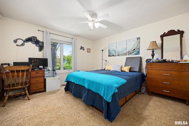 bedroom with carpet flooring, ceiling fan, and a desk
